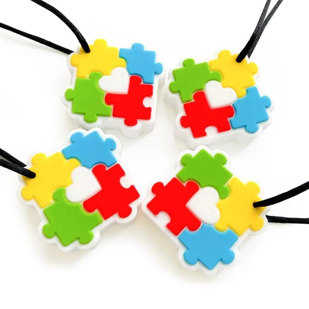 Silicone Sensory Necklace Sensory necklaces are great for kids ages 3+. Discreet and can be worn under tee-shirts at school, in times of stress, anxiety or restlessness our sensory necklaces are there to help. Our block pendant necklaces come fitted with a safety break away clasp like all our silicone jewellery. Blocks are currently available in Blue, Red, Yellow, Green, Orange and Turquoise. Easy adjustable length from child to adult.