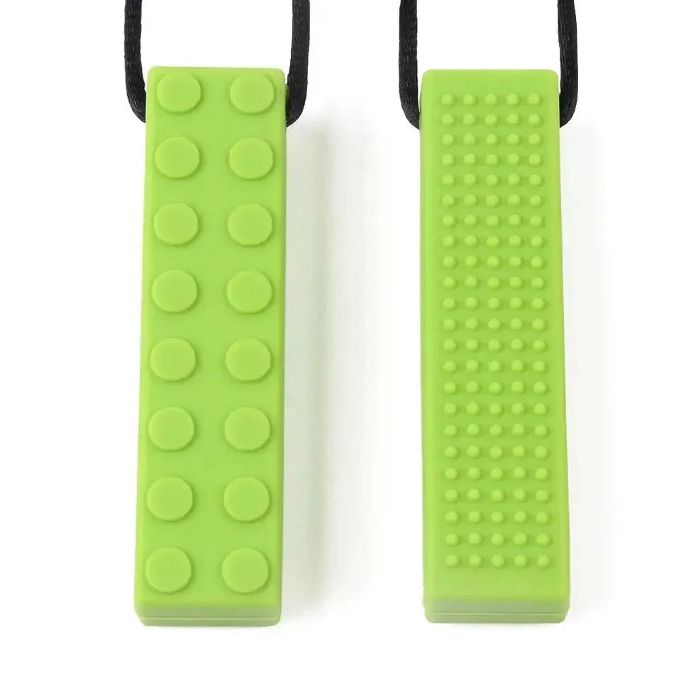 Brick Pendant Silicone Sensory Necklace Sensory necklaces are great for kids ages 3+. Discreet and can be worn under tee-shirts at school, in times of stress, anxiety or restlessness our sensory necklaces are there to help. Our block pendant necklaces come fitted with a safety break away clasp like all our silicone jewellery. Blocks are currently available in Blue, Red, Yellow, Green, Orange and Turquoise. Easy adjustable length from child to adult.